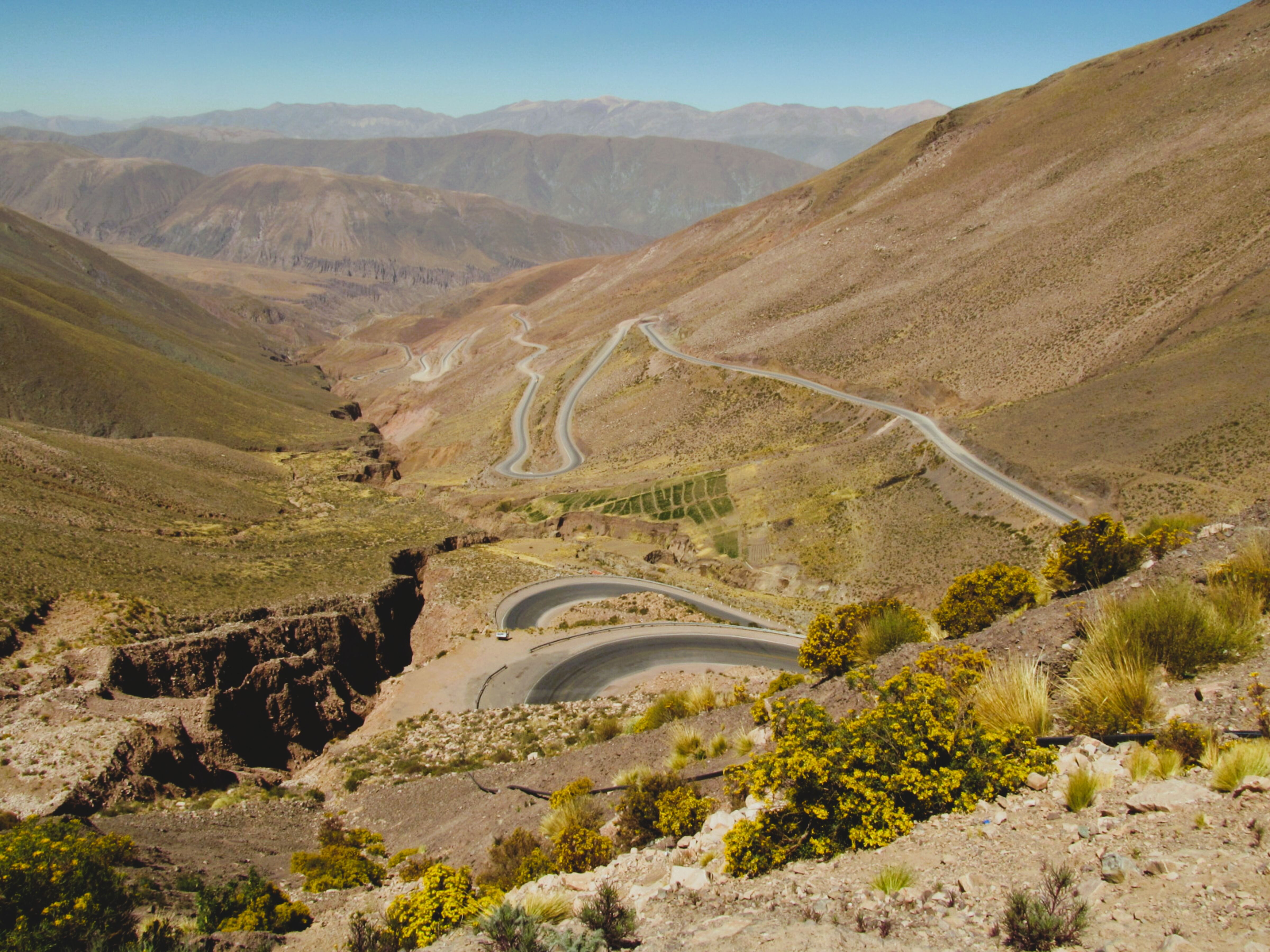 A quiet mountain road winding through the Andes