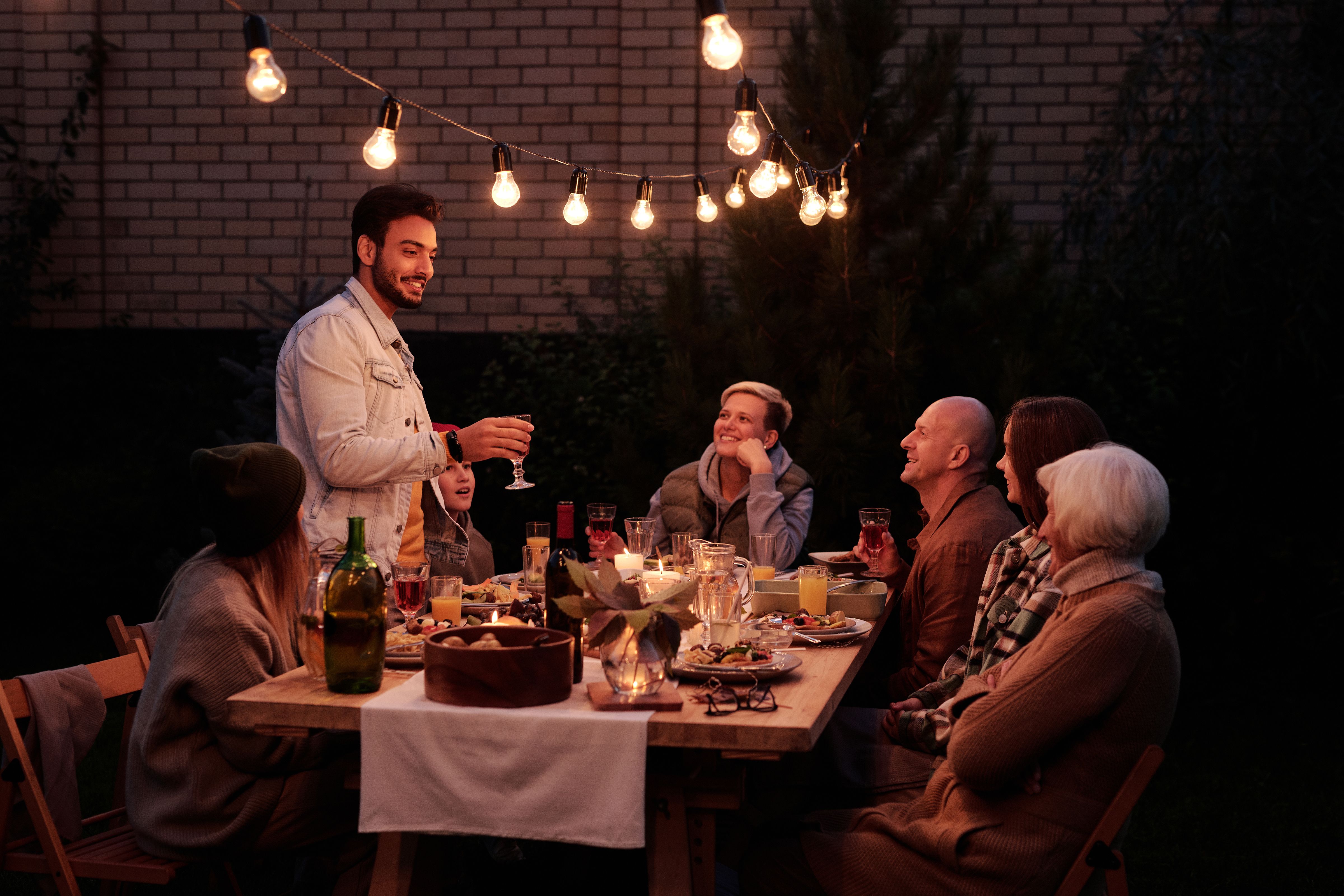 Sharing a meal and conversation at a long table